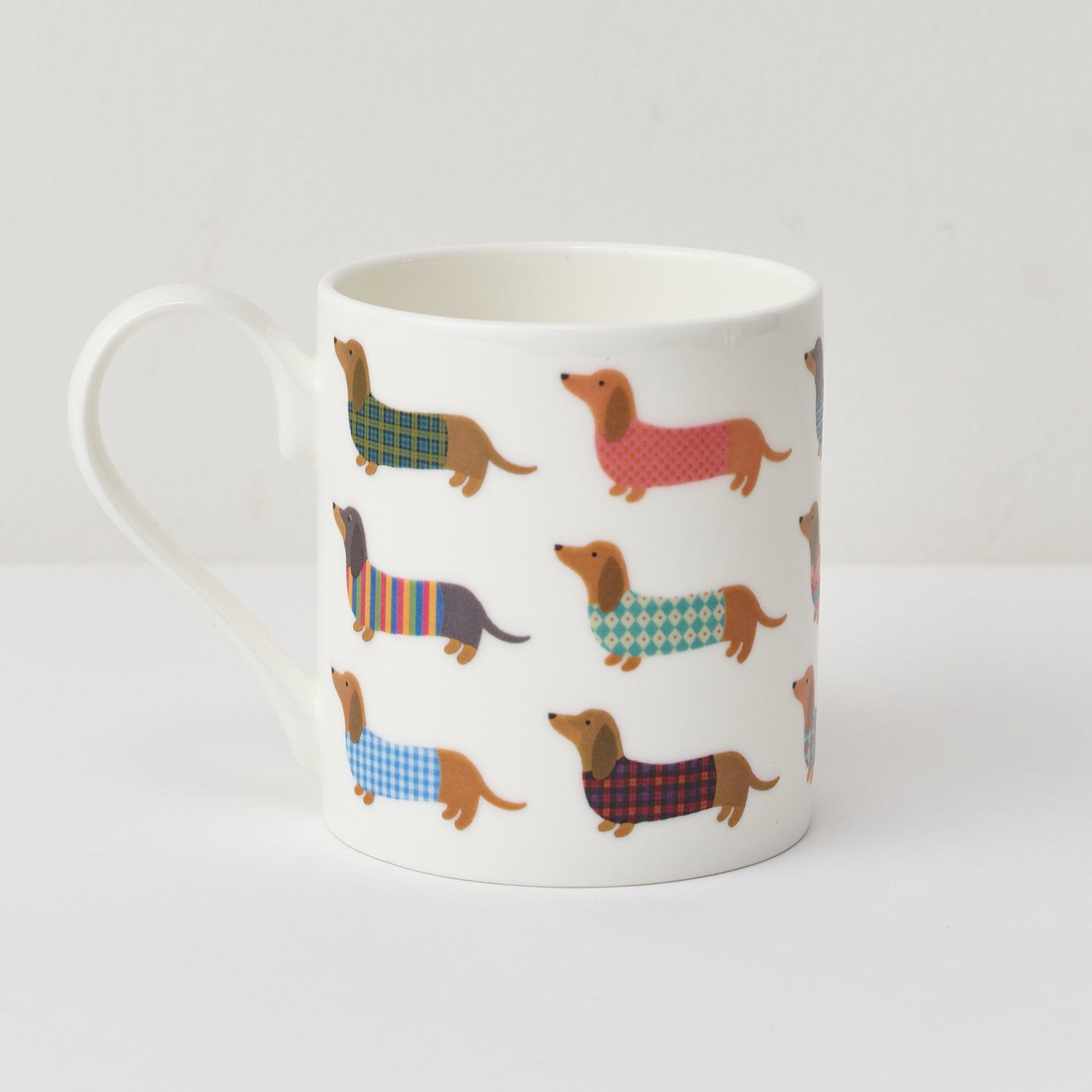 Dashing Dachshund Mug by Mary Kilvert