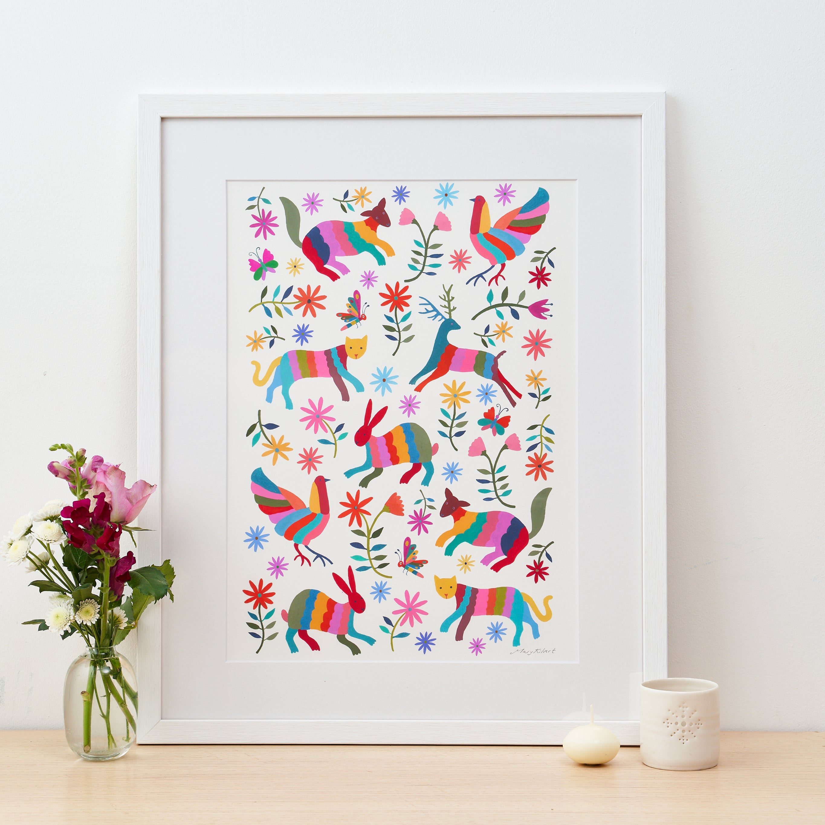 A framed print of Mary Kilvert's Otomi Animals illustration