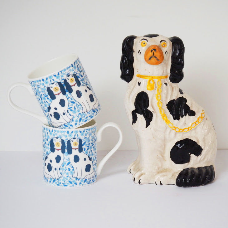 Staffordshire China Dog Mugs by Mary Kilvert stacked next to an ornament
